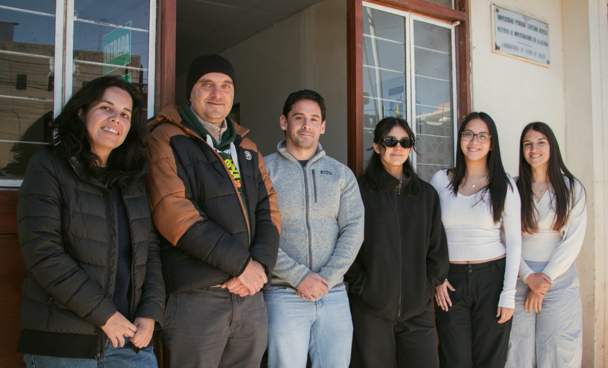 The Peru–UK research team standing together outside the high-altitude research facility in Cerro de Pasco