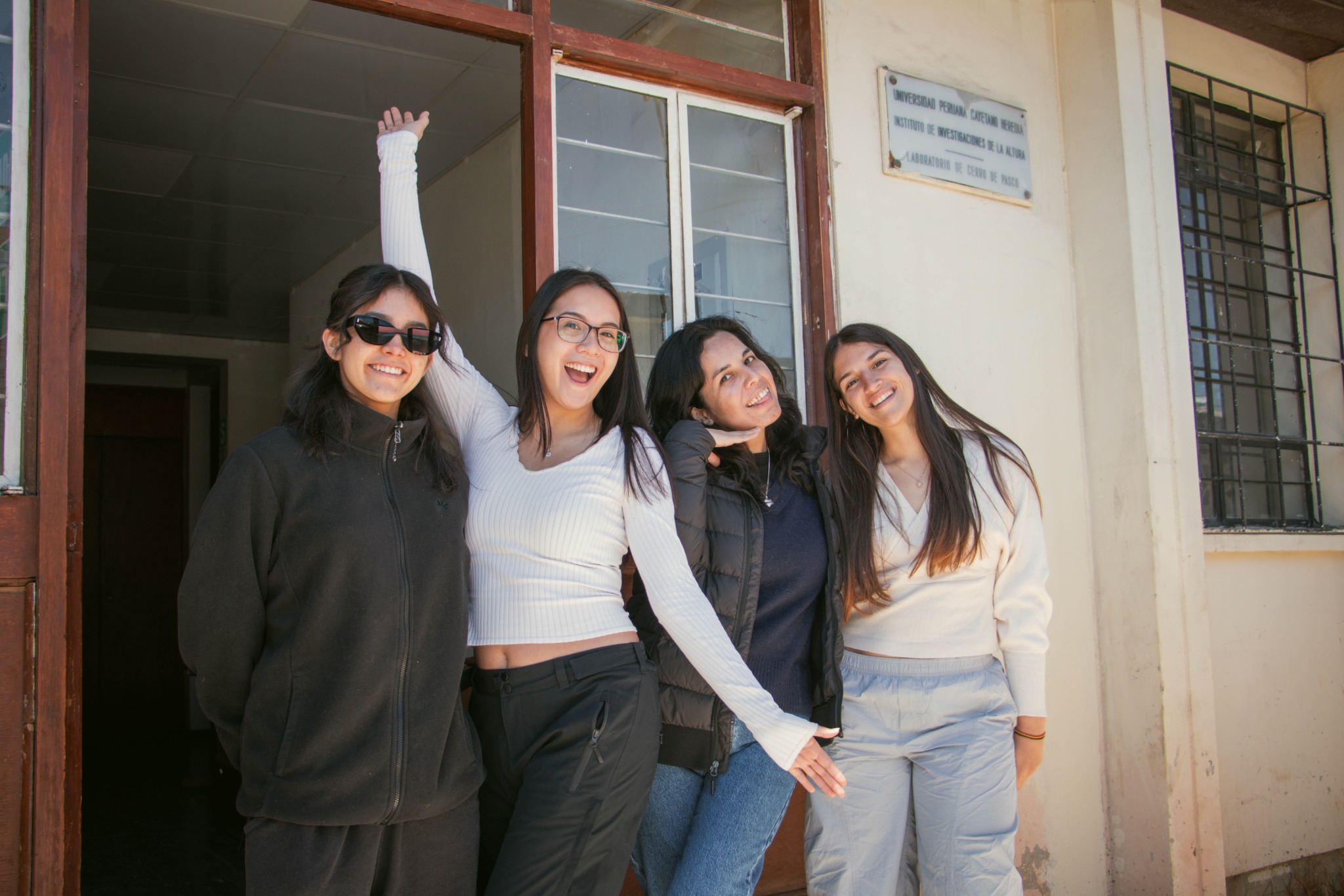 Four young researchers outside the high-altitude research facility in Cerro de Pasco